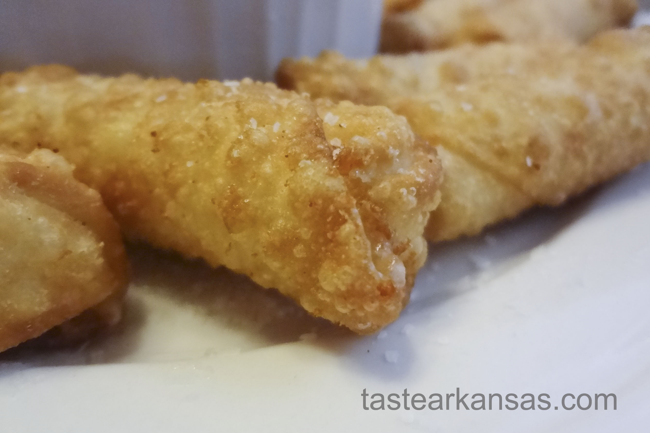 this picture is a close up of wonton wrapper cheese sticks