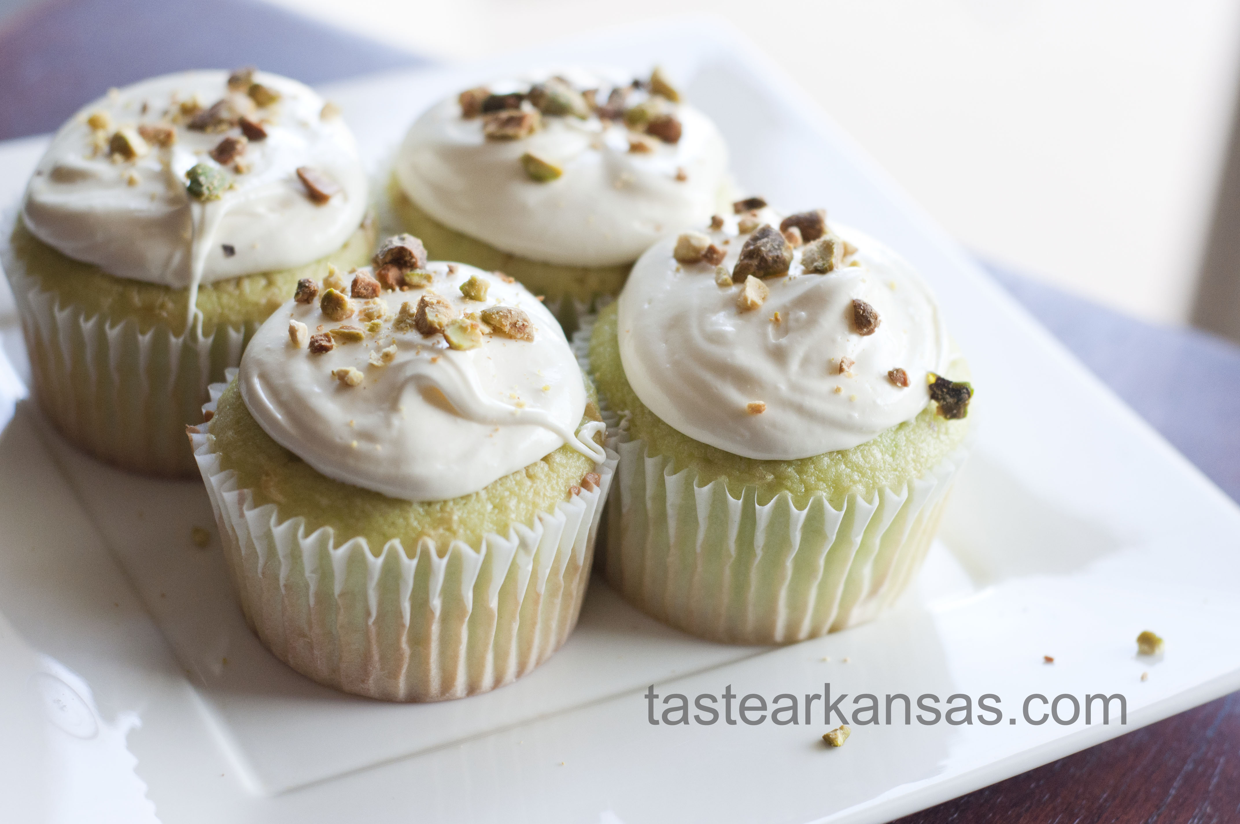 This image is of St. Patrick's Day Pistachio Cupcakes on a white plate